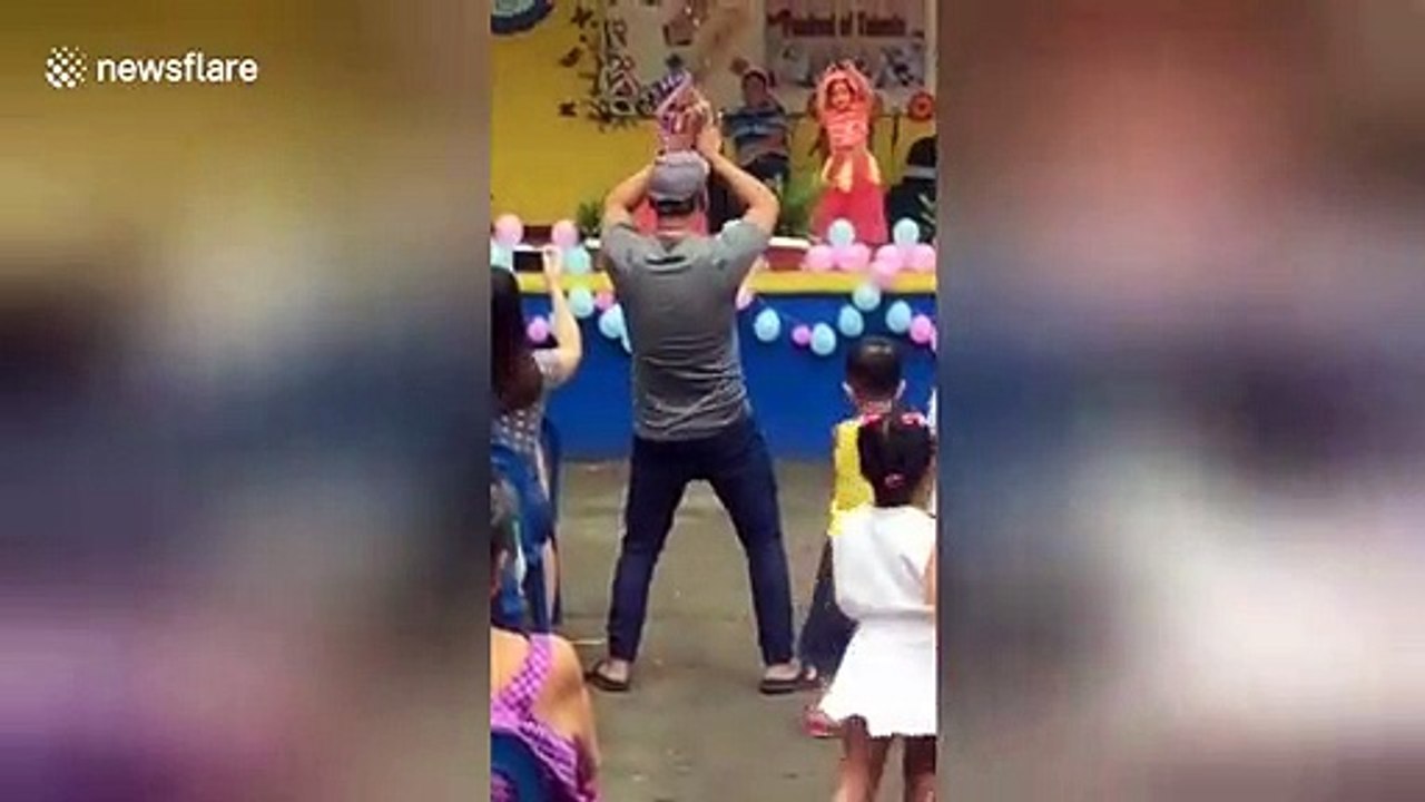 Supportive Filipino father steals the show after dancing along with daughter