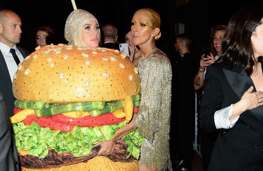 Katy Perry falls over dressed as hamburger
