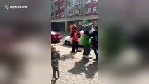 Mascot's head goes rolling after hugging young boy