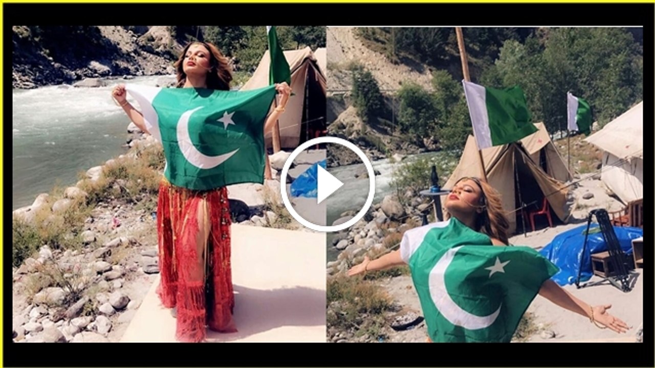 Rakhi Sawant poses with a Pakistani national flag