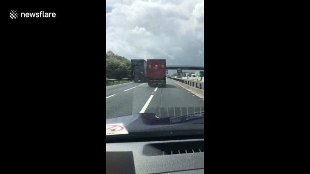 Royal Mail lorry seen dangerously and illegally using two lanes on the motorway