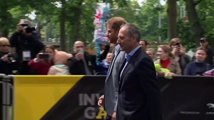 New dad Prince Harry presented with Invictus Babygro