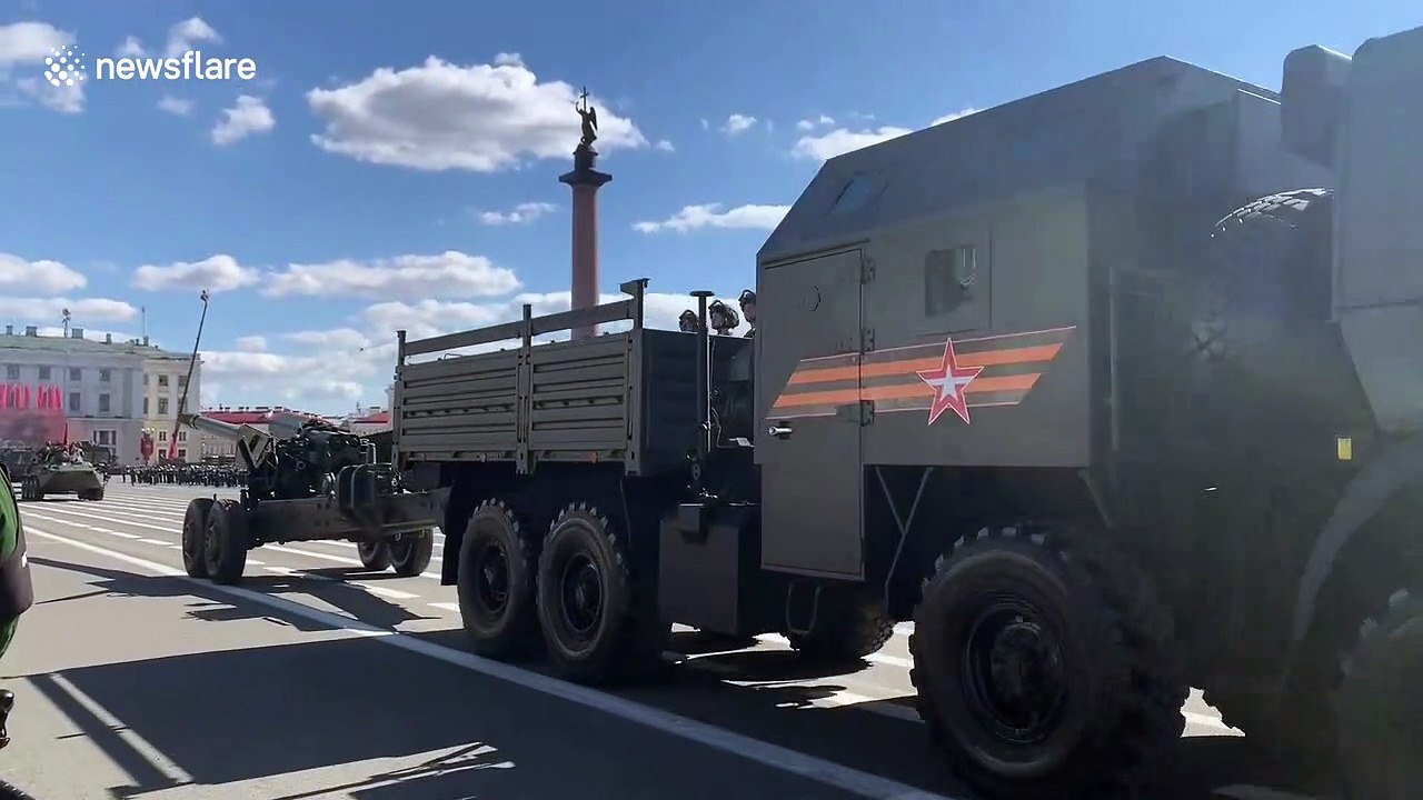 Russian military tanks parade through St. Petersburg's Palace Square on Victory Day