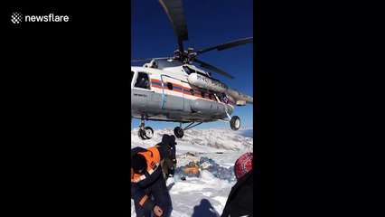 Russian power workers help build pylons at over 10,000-foot altitude