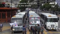 Bus drivers and transport workers block street in Caracas