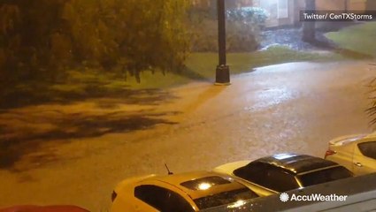 Heavy rain floods streets on college campus