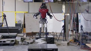 Hulking 165-pound humanoid robot delicately 'walks a tightrope' of tiny blocks