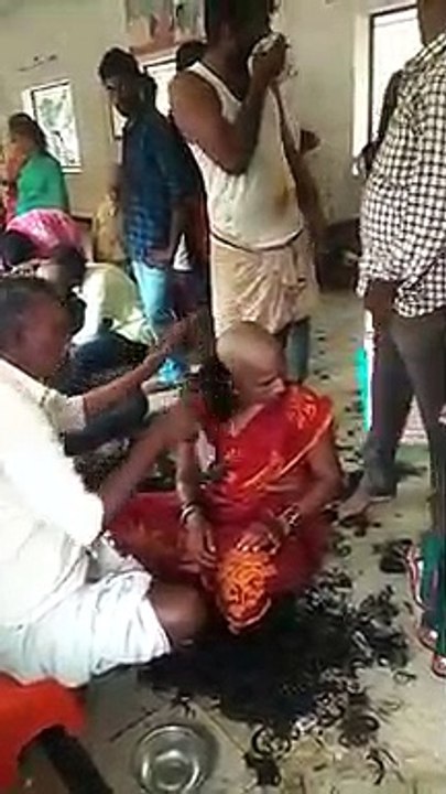 Red Saree lady head shave