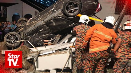 Two killed after car turns turtle in George Town
