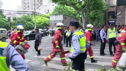 Diggers search rubble on site of Shanghai building collapse