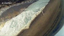 Drone camera spins and rolls in dizzying film of UK cliffside