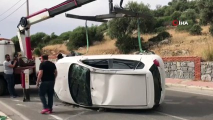 Hamile kadının kullandığı otomobil istinat duvarına çarptıktan sonra takla attı