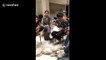 Adorable puppy covers his ears during youth band practice in Thailand