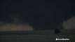 Large wedge tornado swirls ominously at night