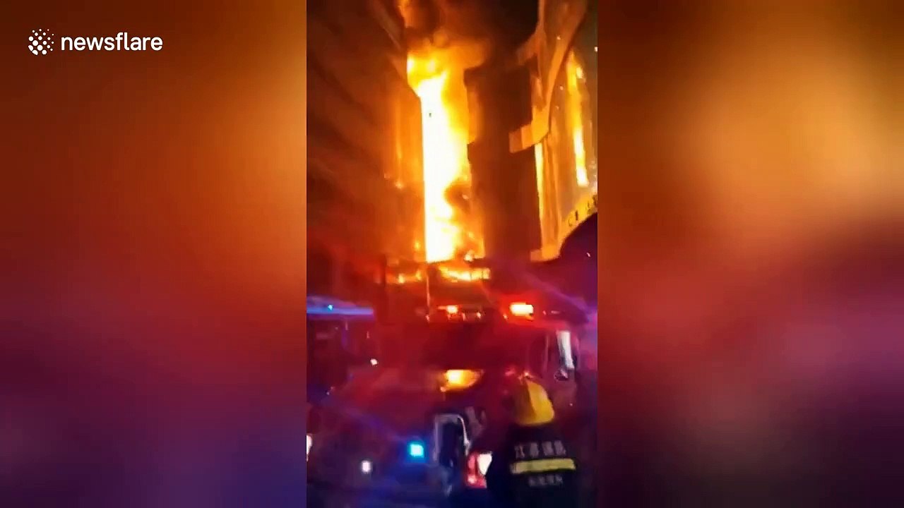 Firefighters on the scene as a mall in China goes up in flames