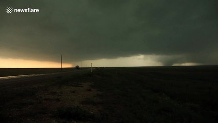 Absolute monster tornado rocks Booker Texas USA as it sweeps across the highway