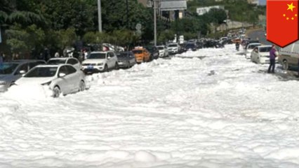 Manholes in China spew mysterious white foam