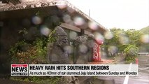 What's causing typhoon-like heavy rain to hit southern regions of S. Korea?