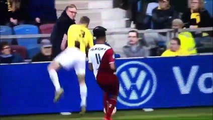Maikel van der Werff tumbles over the advertising boards onto a fan vs Utrecht