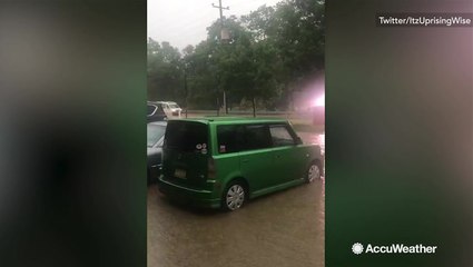 Cars stranded in rising flood waters