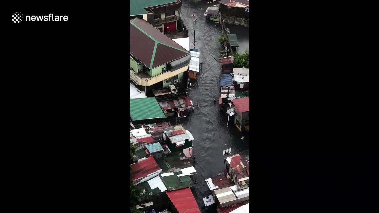 Locals rush to salvage possessions as rainy season floods hit the Philippines