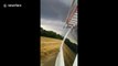 ''It's coming our way!'' Texas driver speeds away from ominous tornado