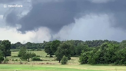 Watch the harrowing moment a huge tornado vortex threatens a water tower in Mabank, Texas