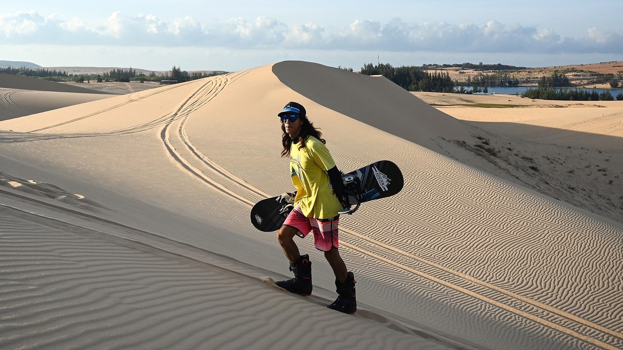 Vietnam athlete carves into sand dunes to realise snowboarding dreams