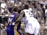 NBA BASKETBALL - Shaquille O'Neal dunks on Dikembe Mutombo