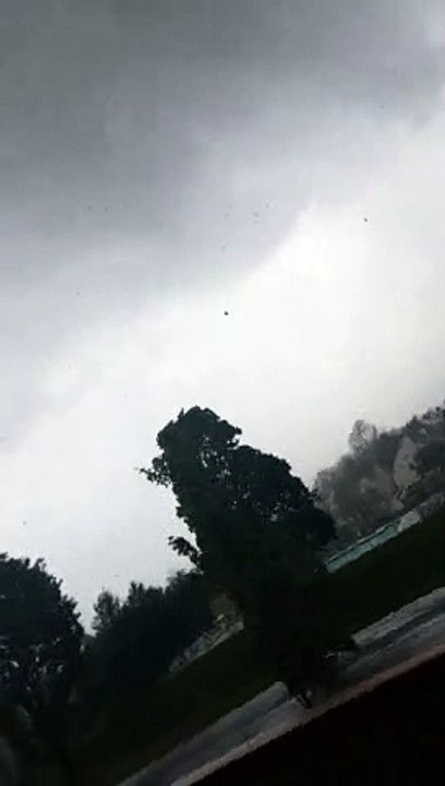 Winds Whip Up Debris Before Tornado Forms