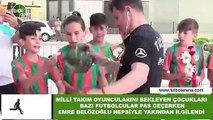 Milli Takım oyuncularını bekleyen çocukları bazı futbolcular pas geçerken Emre Belözoğlu hepsiyle yakından ilgilendi