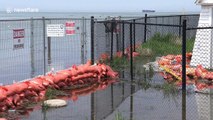 Sandbags fail to stop flooding as Canada's highest water level continues to rise