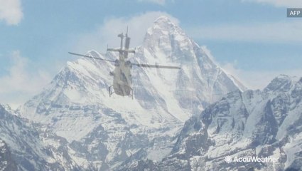 Indian airforces continue search for eight missing climbers following avalanche
