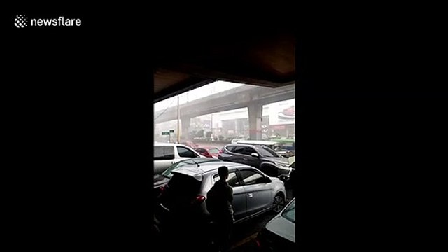 Tropical downpour batters drivers in the Philippines