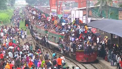 Watch: Bangladeshis crowd trains and ferries hoping to make it home for Eid
