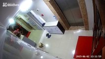 Elevator doors in Chinese apartment suddenly crash open after stone gets stuck inside