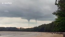 Rare double waterspout amazes beachgoers in southern Thailand