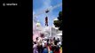 Bizarre moment Guatemalan mayor whips crowd into frenzy in Iron Man costume AND FLIES at campaign event