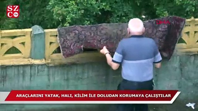 Araçlarını yatak, halı, kilim, örtü ve havluyla 'dolu'dan korumaya çalıştılar