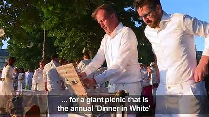 Thousands of guests take part in secret Paris "Dinner in White"