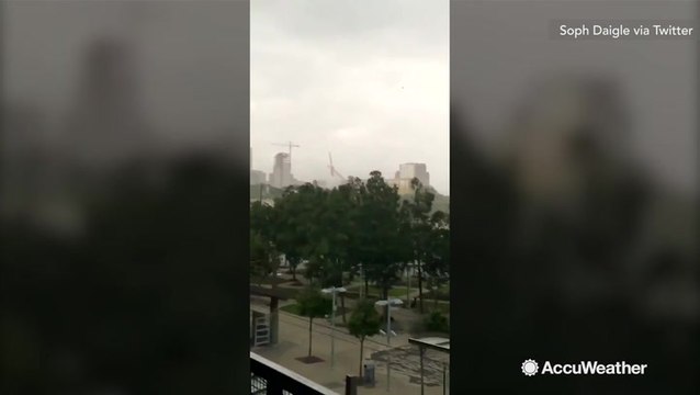 Wind slams crane onto apartment building, killing 1 and injuring 6