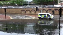 Kind men help stranded motorist during flooding in West London
