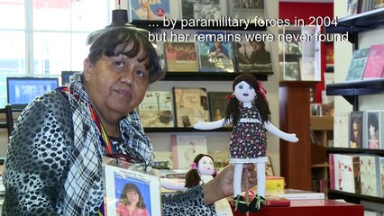 Colombian war victim makes dolls to heal her own pain