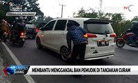 Mengais Rezeki Sebagai Pengganjal Ban Pemudik