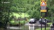 UK drivers cross flooded road in Birmingham despite warnings