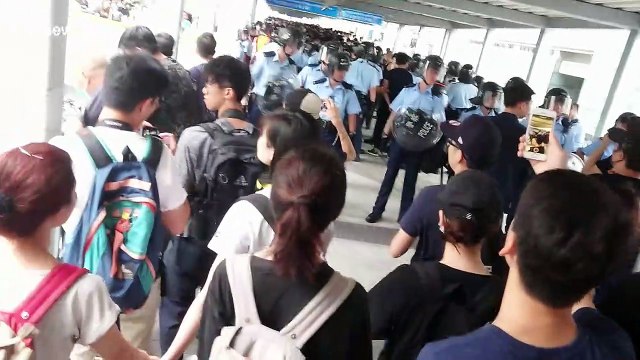 Hong Kong riot police retreat in face of demonstrators during extradition bill protest