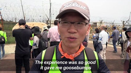 South Koreans join hike along a trail in the DMZ