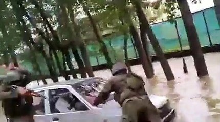 Army personnel rescued a car from overflowing at Pattan. Responding to distress call, waded through waist deep water & rescued two Kashmiri's.