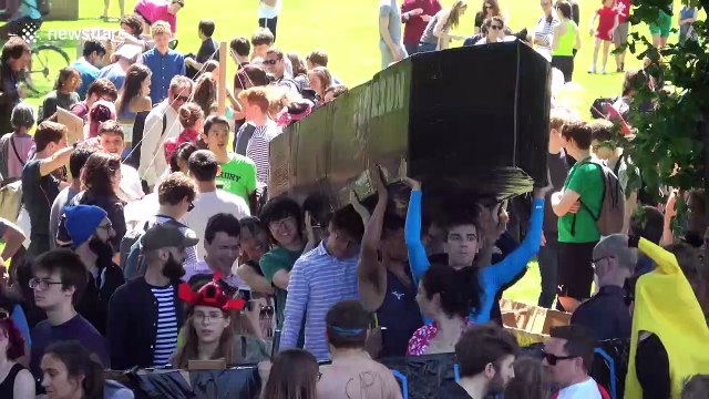 Boozed-up Cambridge University students celebrate end of exams with annual cardboard boat race