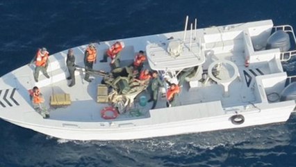 US military releases new images of ‘Iranian forces removing unexploded mine’ from ship near Strait of Hormuz